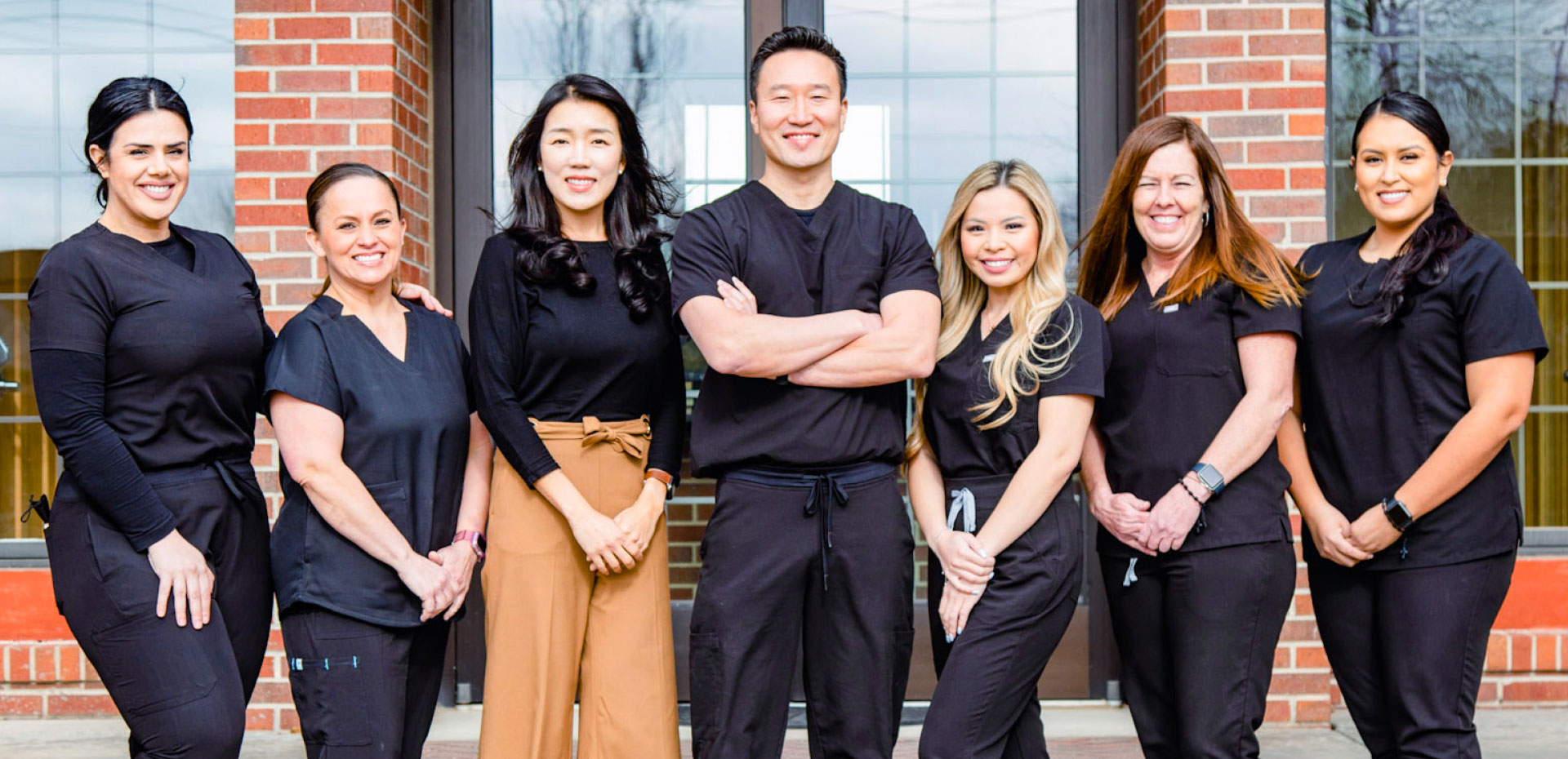 team-hero Sim Family Dental Team group photo